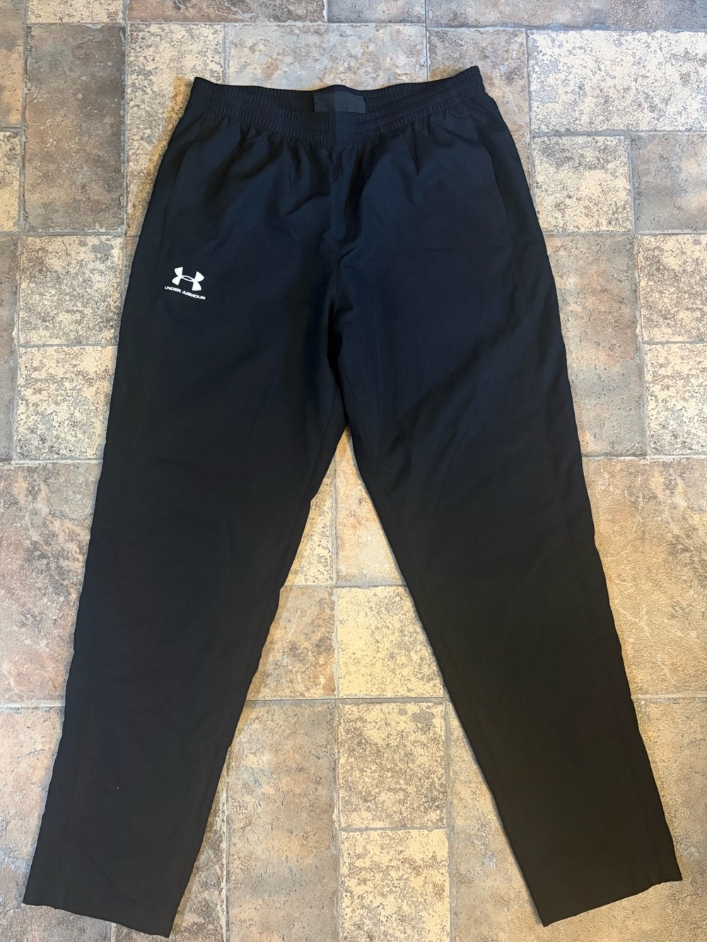 UA men’s loose fit track pants
